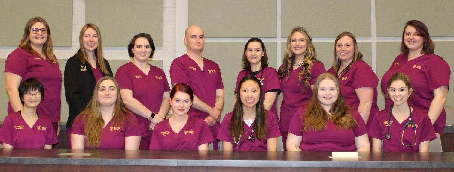 14 vet tech students in scrubs